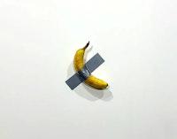 maurizio cattelan's comedian, a duct taped-banana sells for $120.000 at art basel in miami